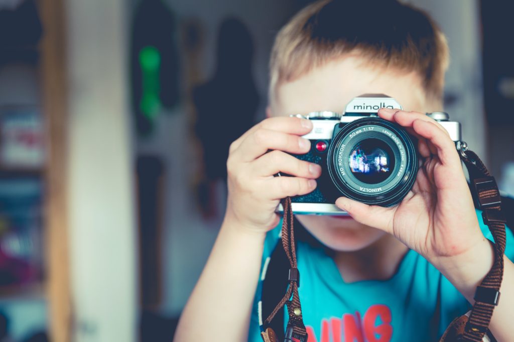 Child with camera. Creative commons image from Unsplash.